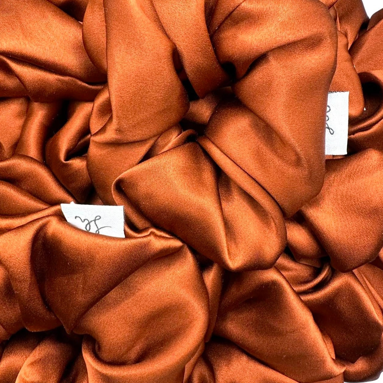 Síoda Silky 100% Mulberry Silk scrunchie size medium colour is Burnt Orange